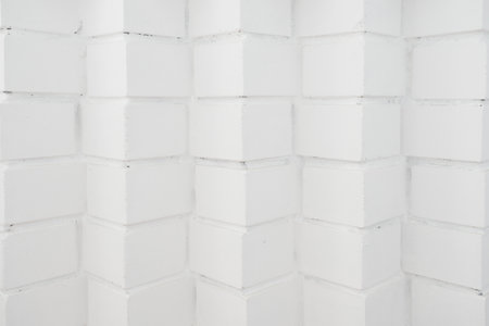 Abstract background. Empty white brick surface. Original brick laying at angle forward. Back for designの写真素材