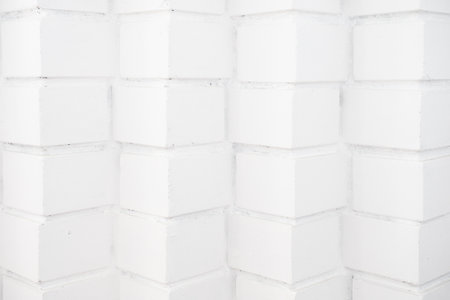 Abstract background. Empty white brick surface. Original brick laying at angle forward. Back for designの写真素材