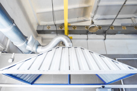 Industrial hood in production workshop. Room ventilation system. Background.の写真素材
