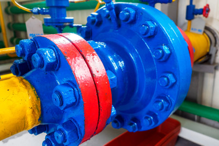 Connection unit for metal pipes with large bolts. Supply of natural gas through pipes. Preparing for heating season.の写真素材