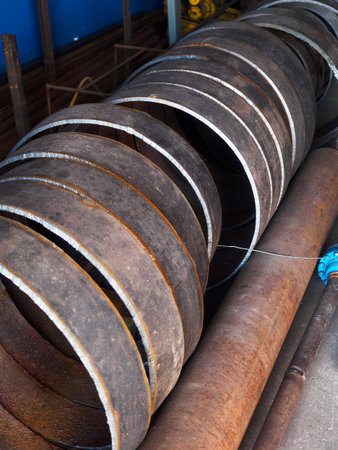Round metal rings for joining and welding pipes. Procurement for repair of the pipeline. Industrial background.の写真素材