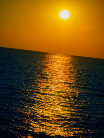 Sunset on the sea. Reflection of the sun on the surface of the sea. Background.の写真素材