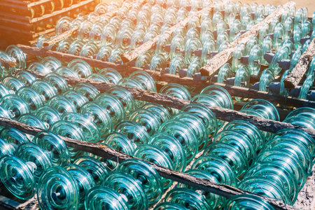 Glass transparent high-voltage insulator is in storage. Industrial background.の写真素材