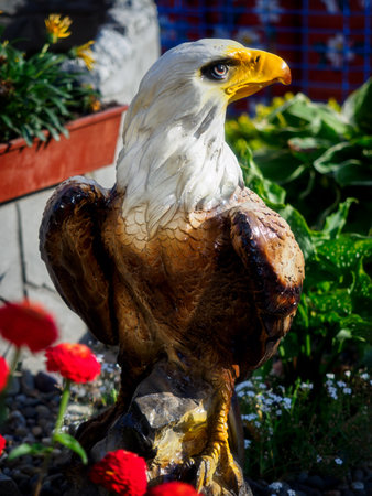 Figure of eagle made of stone. Stuffed bird of prey. Background.の写真素材