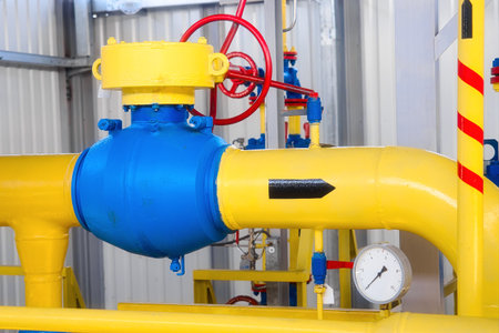 View of yellow pipe for transporting natural gas inside gas distribution station. Industrial facility. Background.の写真素材