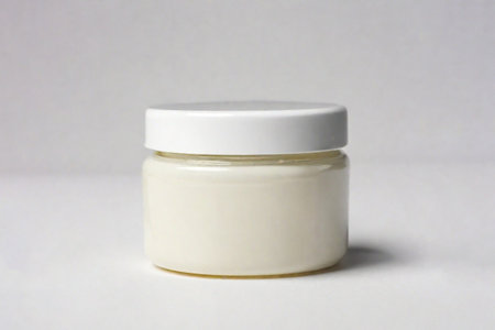 Jar for body and face cream on light background. Layout for advertising. Generated by artificial intelligence. Mockup.の素材