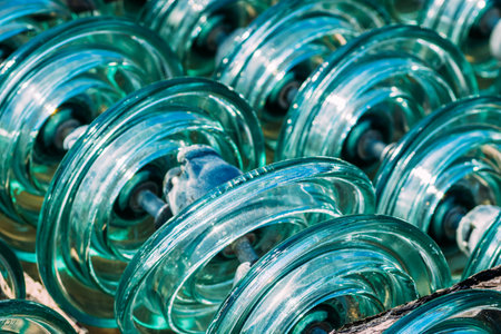 Glass transparent high-voltage insulator is in storage. Industrial background.の写真素材