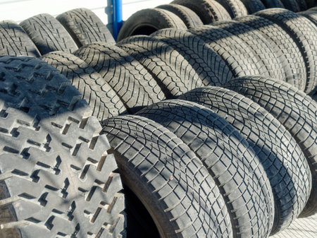 Used car tires. Rubber wheel tires. Recycling of old worn-out truck tires. Background.の写真素材