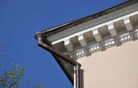 part of the roof of the old house with the drainpipe
