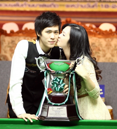 SUPHANBURI, THAILAND - FEB 24 Thepchaiya Un-nooh of Thailand with the trophy after final match of Sangsom Thailand ranking circuit 2013 at Patchara Hotel on february 24, 2013 in Suphanburi, Thailand のeditorial素材