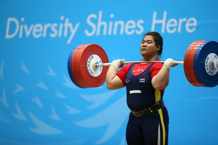 INCHEON - SEP 26:Chitchanok PULSABSAKUL of Thailand in action during the 2014 Incheon Asian Games at Moonlight Festival Garden Weightlifting Venue on September 26, 2014 in Incheon, South Korea.のeditorial素材