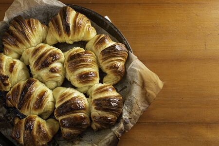 Home made croissants recently baked, cooling down in the roasting pan. Meanwhile the first morning...