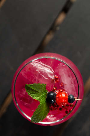 Cocktail Negroni on a wooden board. Negroni cocktail at the bar. Selective focus