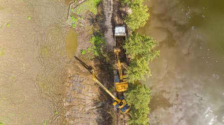 Reconquista, Argentina - 20 of October 2020: industrial excavators loading a truck. Drone view