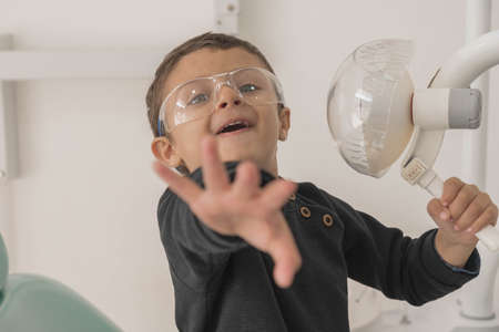 Child playing in dental office.の写真素材