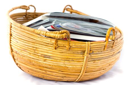 Willow shoot basket filled with magazinesの写真素材