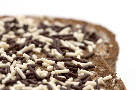 whole wheat sandwich covered with chocolate sprinkles in two colors - Close-upの写真素材