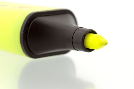 Yellow marker on shiny reflecting surface - close upの写真素材