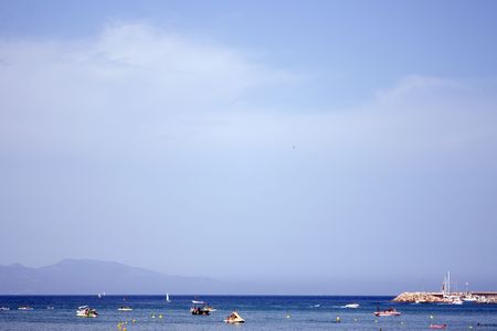 View over sea. Mountains on the background