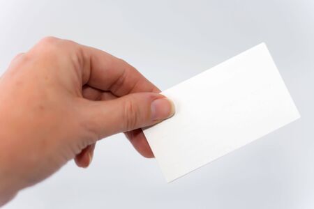 Womens hand holding blank business cardの写真素材