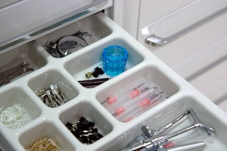 Dentist tools in open drawerの写真素材