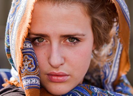 Veiled girl looking intensly into the cameraの写真素材