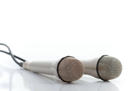 Two microphones on reflecting white backgroundの写真素材