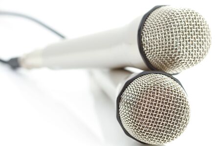 Two microphones on reflecting white backgroundの写真素材