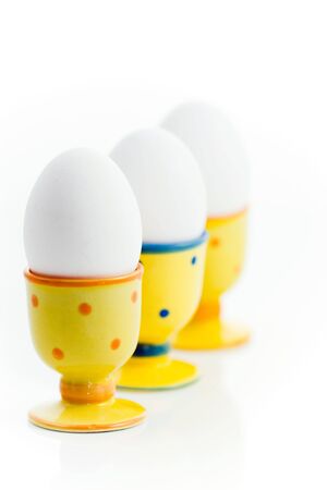 eggs in egg-cupsの写真素材