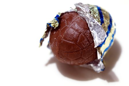Chocolate easter egg in Aluminium foilの写真素材