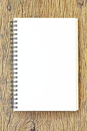 Notebook  on wooden tableの写真素材