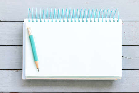 Notebook on woNotebook on wooden tableoden table