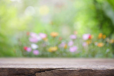 outdoor wooden table view with flowers