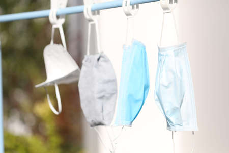 Protection mask laundry hanging under the sunの写真素材