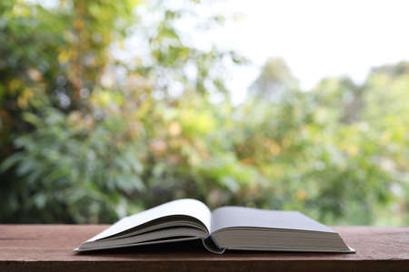 Opened Notebooks on wooden tableの写真素材
