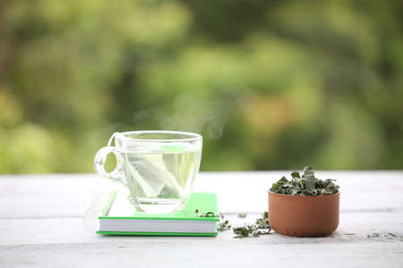 Pandan tea and leaves piles with notebookの写真素材