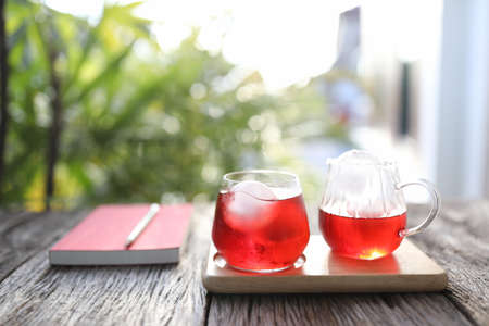Ice Red strawberry juice with diary notebooks and pencilの写真素材