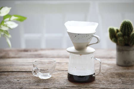 Coffee drip and Coffee glass cup on black table