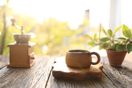 Wooden coffee cup and coffee grinderの写真素材