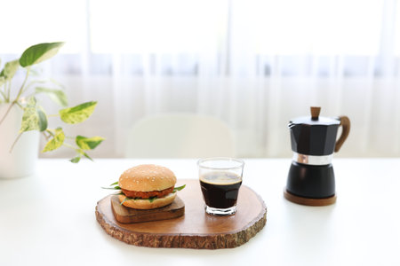Coffee with crema coffee in a a glass cup wooden trayの写真素材