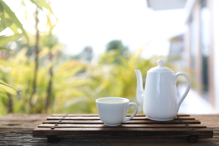 White tea pot and tea cup