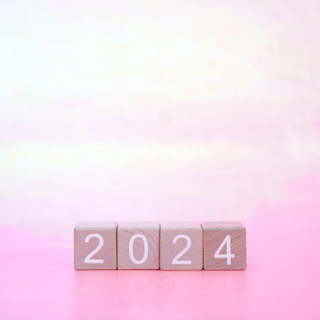 2024 wooden blocks on pink backgroundの写真素材
