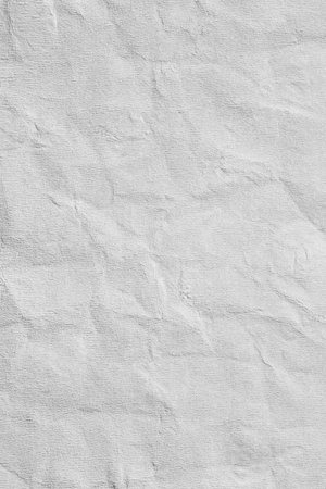 Grey kraft crumpled paper texture with patternの写真素材