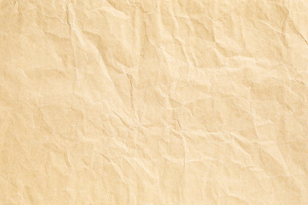 Yellow crumple paper texture backgroundの写真素材