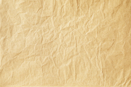 Yellow crumpled paper texture backgroundの写真素材