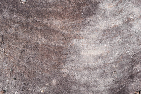 rock with natural patina stain caused by rain waterの写真素材