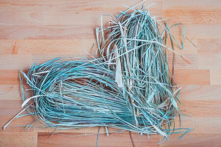 Dried Lemon grass in the shape of a heart on the wooden floorの写真素材