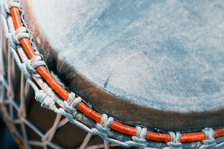 Part of the old African bongo drum closeup.の写真素材