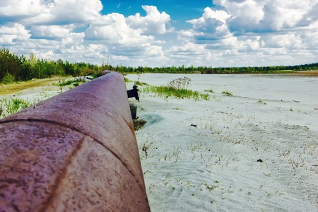 Rusty pipeline around the development of quartz sand.の写真素材