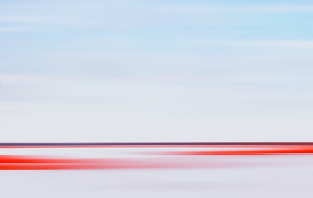 Abstract motion blurred light landscape background with horizontal red stripe and horizon line. Large space for copy text.の写真素材